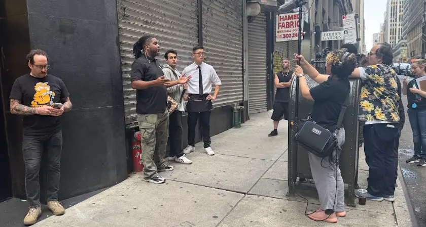 The crew captures an exterior scene