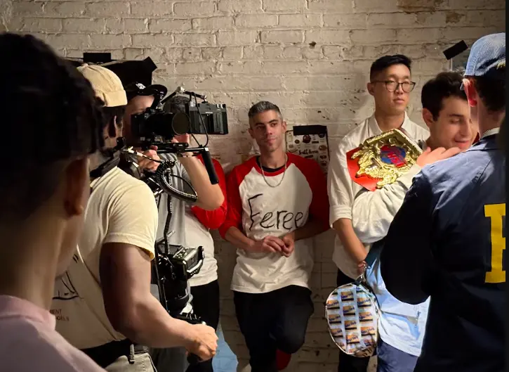 Camera crew captures a basement scene