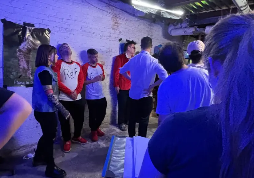 Cast and crew prepare on the basement set