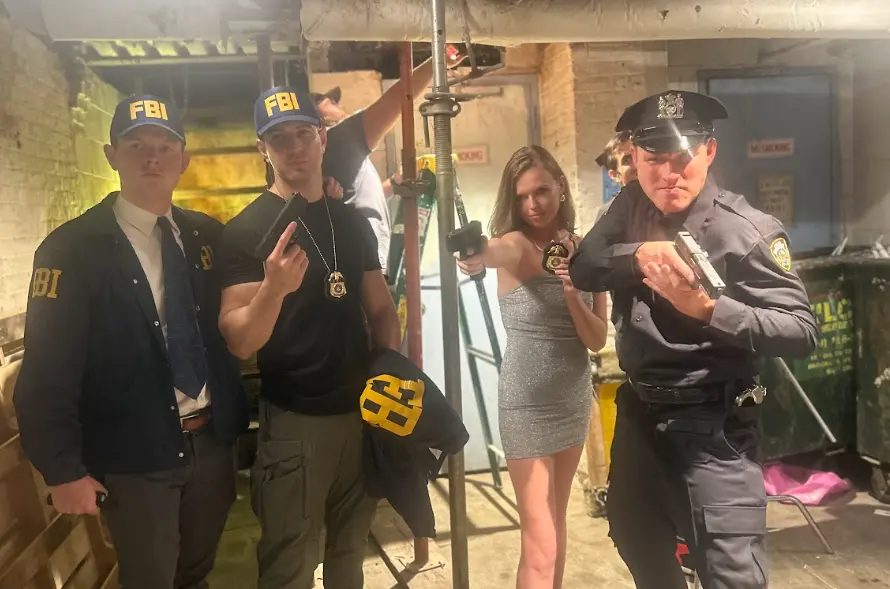 FBI and police characters pose between takes