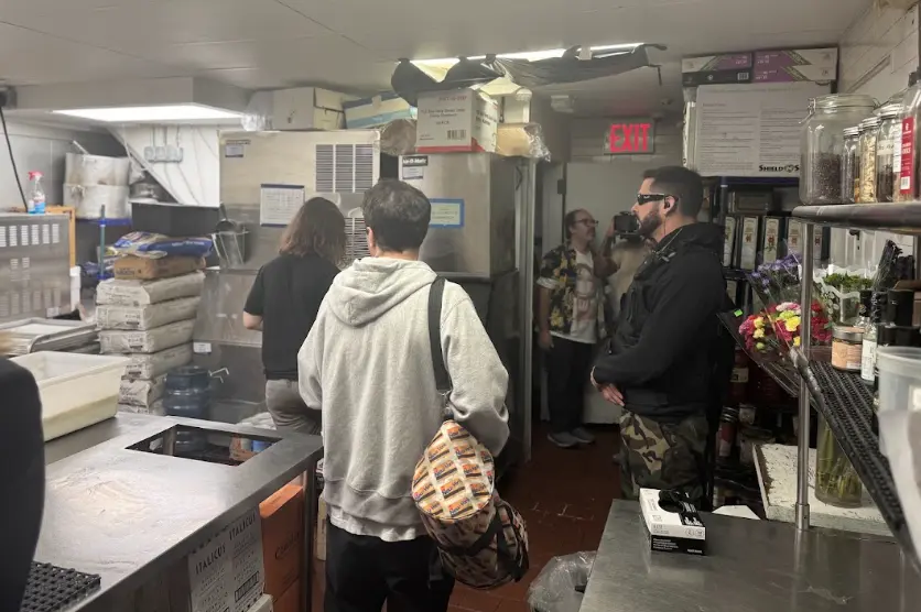 The crew prepares a kitchen location