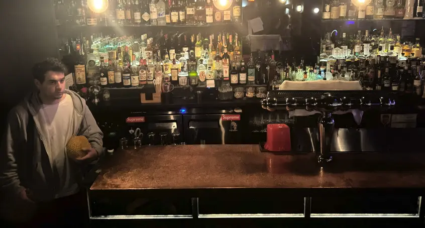 A scene with the durian behind the bar